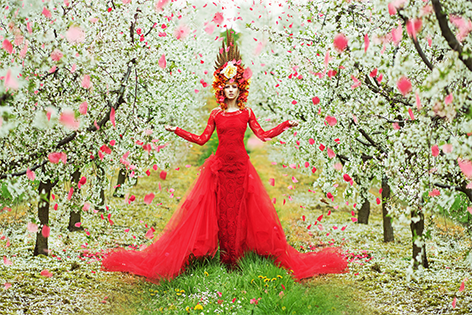 Woman in blooming garden